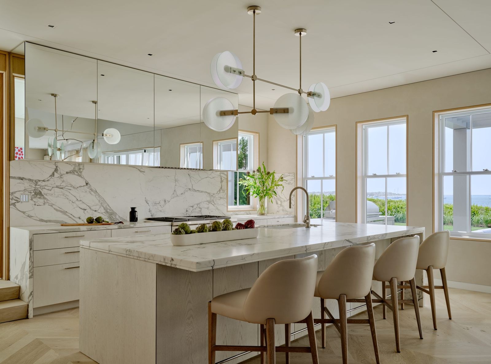 Kitchen at Shimmo Residence with sculptural pendant lighting